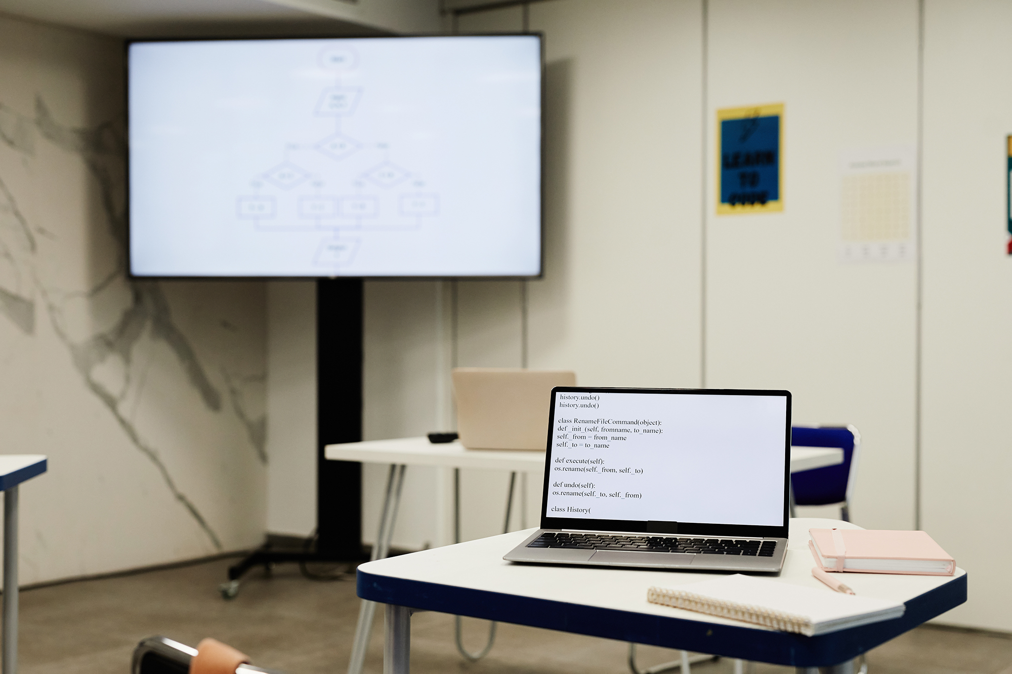 Interactive digital whiteboard displaying educational content in a modern classroom or training room.